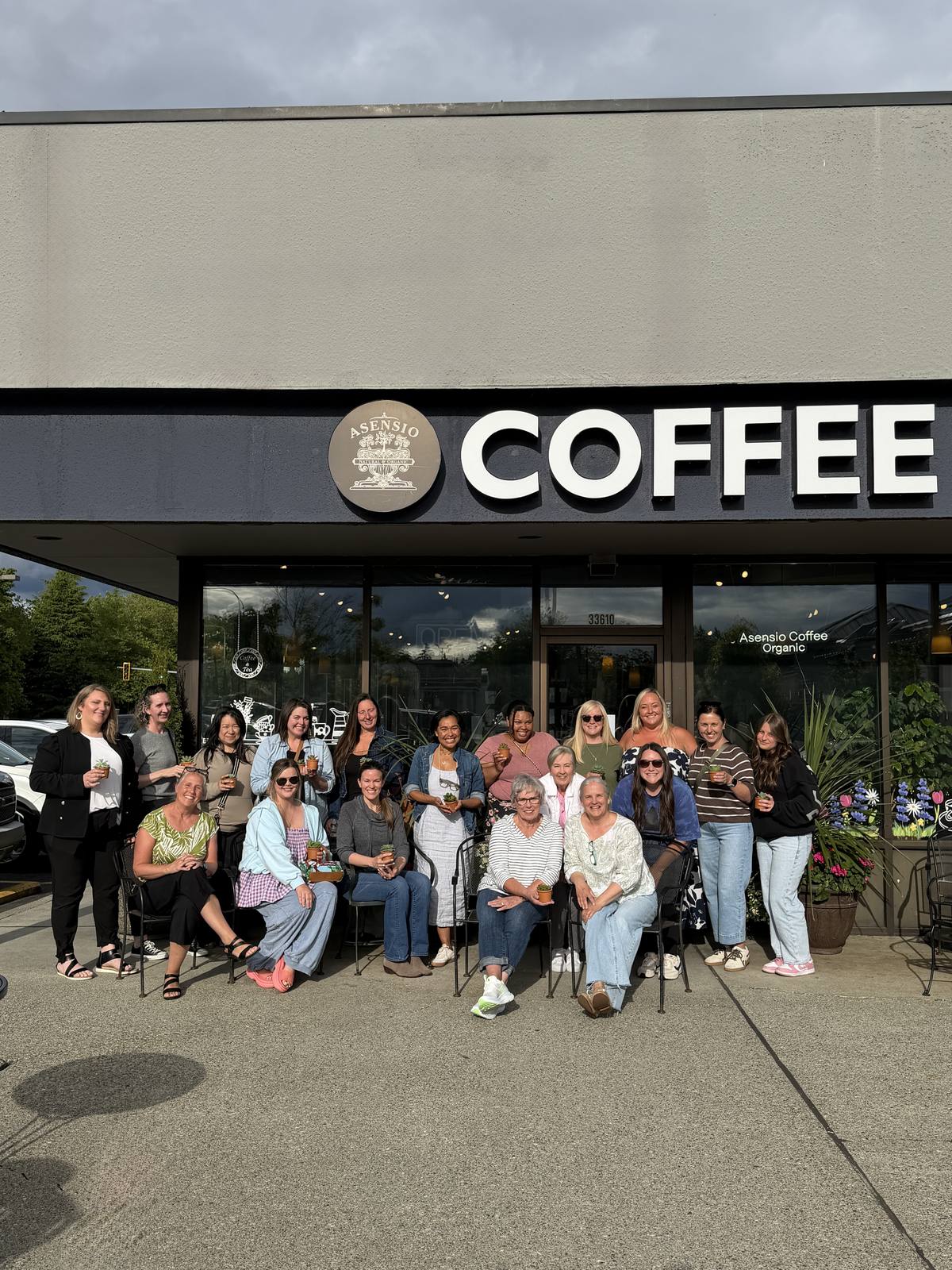 Community gathering outside a neighborhood coffee shop client